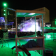 A lifeguard watches over a mostly empty pool at Alienstock in Las Vegas